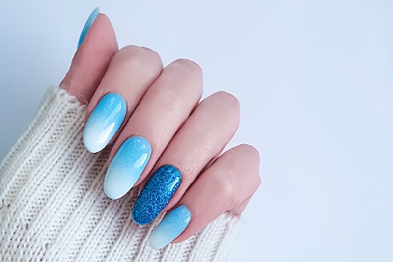  A blue gel nail polish manicure with accent colours.